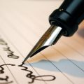 man writing a contract